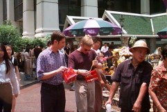 Making an offering for good luck on the road