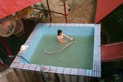 The snake lady gives her python a bath